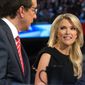 In this Thursday, Aug. 6, 2015 photo, Fox News moderators Megyn Kelly, right, listens as Chris Wallace, begins introductions during the first Republican presidential debate at the Quicken Loans Arena, in Cleveland. Angry over what he considered unfair treatment at the debate, republican presidential candidate Donald Trump told CNN on Friday night that Kelly had &amp;quot;blood coming out of her eyes, blood coming out of her wherever.&amp;quot; (AP Photo/John Minchillo)