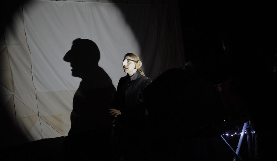 Puppeteers from Drama of Works performs a shadow puppet show for fellow puppeteers attending at the National Puppetry Festival at the University of Connecticut, Monday, Aug. 10, 2015, in Storrs, Conn. Puppeteers from around the world began descending on UConn Monday to participate in the weeklong festival of all things puppet. (AP Photo/Jessica Hill)