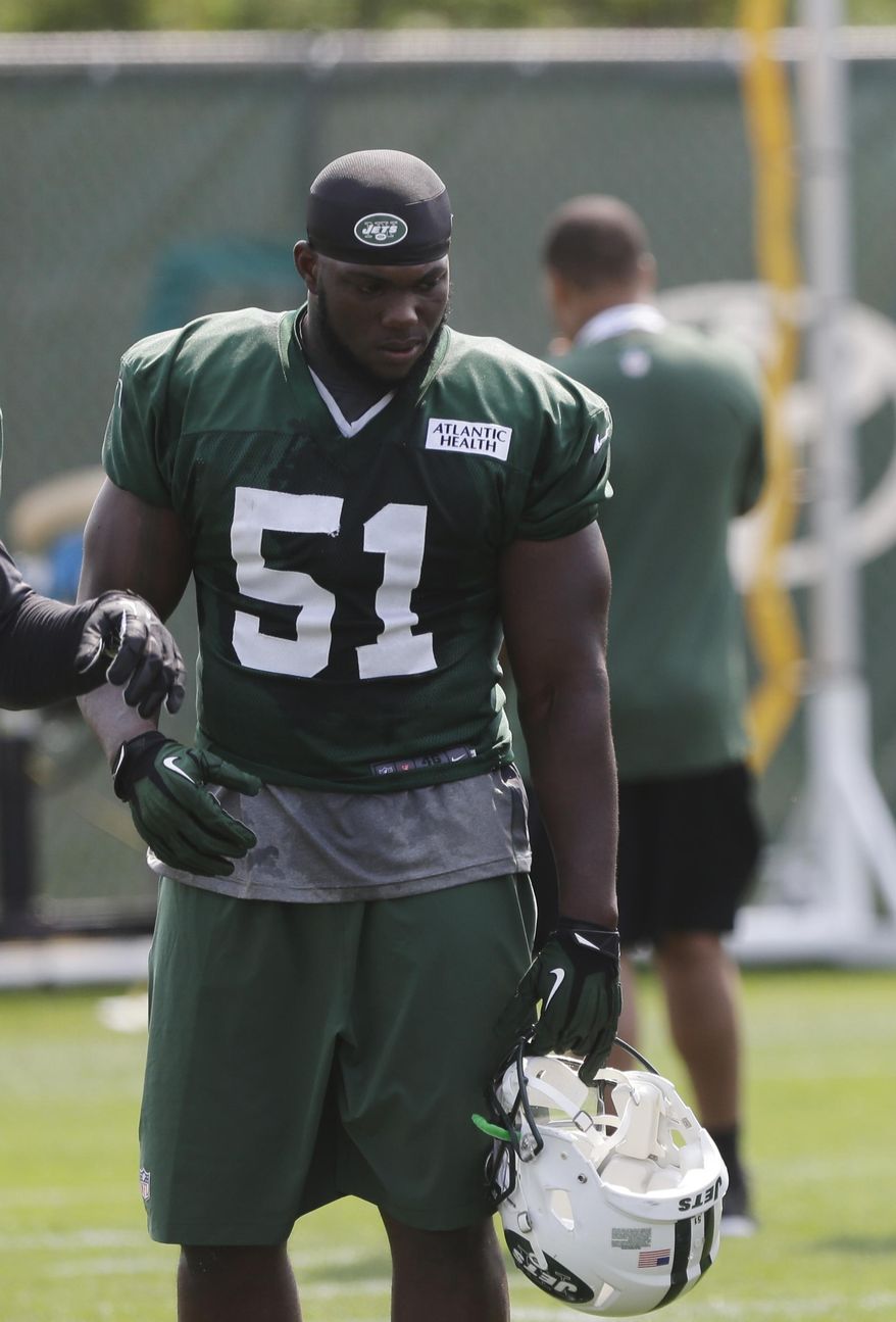 FILE - In this July 25, 2014, file photo, New York Jets' Ikemefuna Enemkpali (51) listens to a coach during an NFL football training camp in Cortland, N.Y. New York Jets quarterback Geno Smith will be sidelined at least 6-10 weeks after being punched in the jaw by teammate Ikemefuna Enemkpali. Coach Todd Bowles made the announcement before training camp practice Tuesday, Aug. 11, 2015, in Florham Park, N.J. Enemkpali, an outside linebacker in his second season, has been released by the Jets, according to Bowles. (AP Photo/File)