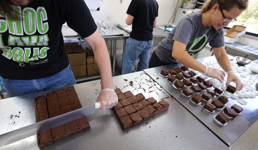 Smaller-dose pot-infused brownies are divided and packaged at The Growing Kitchen in Boulder, Colo., on Sept. 26, 2014. (Associated Press) **FILE**