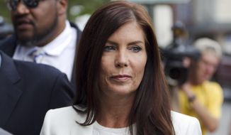 FILE - In this Aug. 8, 2015, file photo, Pennsylvania Attorney General Kathleen Kane arrives to be processed and arraigned on charges she leaked secret grand jury material and then lied about it under oath at the Montgomery County detective bureau in Norristown, Pa. Kane has scheduled a news conference for Wednesday, Aug. 12, at the state Capitol to publicly discuss the criminal charges leveled against her last week in connection with an alleged political payback scheme. (AP Photo/Laurence Kesterson, File)