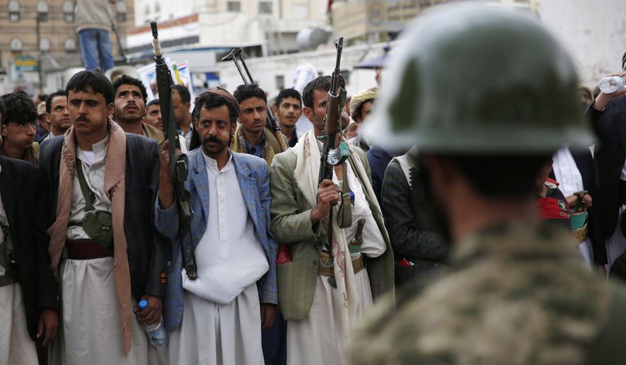 Shiite rebels known as Houthis holds their weapons during a rally against Saudi-led airstrikes in Sanaa, Yemen, on Aug. 11, 2015. (Associated Press) **FILE**
