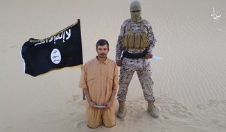 This image made from a militant video posted on a social media site on Wednesday, Aug. 5, 2015, which has been verified and is consistent with other AP reporting, purports to show a militant standing next to another man who identifies himself as 30-year-old Tomislav Salopek, kneeling down as he reads a message at an unknown location. An online image purports to show the Croatian hostage being held by an Islamic State affiliate in Egypt has been beheaded. (Militant video via AP, File)

