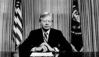 FILE - In this April 25, 1980 file photo, President Jimmy Carter prepares to make a national television address from the Oval Office at the White House in Washington, on the failed mission to rescue the Iran hostages. On Wednesday, Aug. 12, 2015, Carter announced he has cancer and will undergo treatment at an Atlanta hospital. (AP Photo)