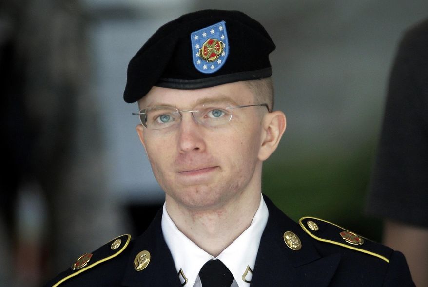 In this June 5, 2013, file photo Army Pvt. Chelsea Manning, then-Army Pfc. Bradley Manning, is escorted out of a courthouse in Fort Meade, Md., after the third day of her court martial. (AP Photo/Patrick Semansky, File)