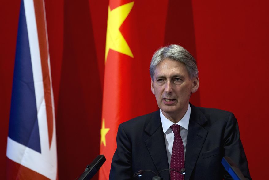 British Foreign Secretary Philip Hammond delivers his speech at Peking University in Beijing Wednesday, Aug. 12, 2015. Hammond said Wednesday that an international agreement to limit Iran's nuclear program could give impetus to efforts aimed at curbing North Korea's nuclear weapons program. (AP Photo/Andy Wong)