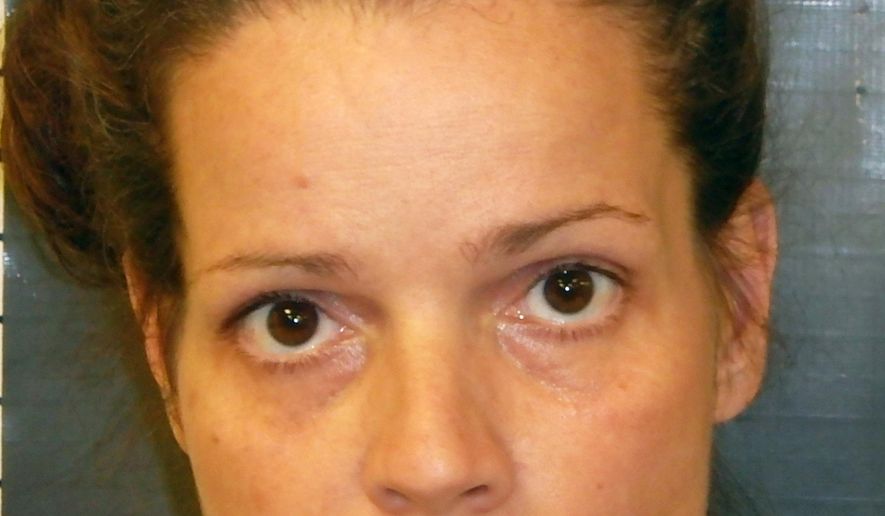 This Aug. 9, 2015 law enforcement booking photo provided by the Nye County, Nev., Sheriff's Office shows Maria Furtado, 40, of Pahrump, Nev. Furtado was arrested on animal cruelty, felony child abuse and neglect and theft charges after she was accused of taking her children with her to abduct and kill a neighbor’s dog. Investigators believe Furtado was retaliating after the dog attacked and killed two of her ducklings last week.(Nye County Sheriff’s Office via AP)