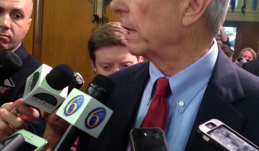 Michigan Public Service Commission member Norm Saari, former top aide to Republican House Speaker Kevin Cotter, answers reporters' questions after a Senate advice-and-consent hearing on Thursday, August 13, 2015 in Lansing, Mich. Democrats say Saari ignored whether Reps. Todd Courser of Lapeer and Cindy Gamrat of Plainwell misused public funds in an attempt to hide their relationship. Saari told reporters he did nothing wrong and Cotter acted appropriately. (AP Photo/David Eggert)