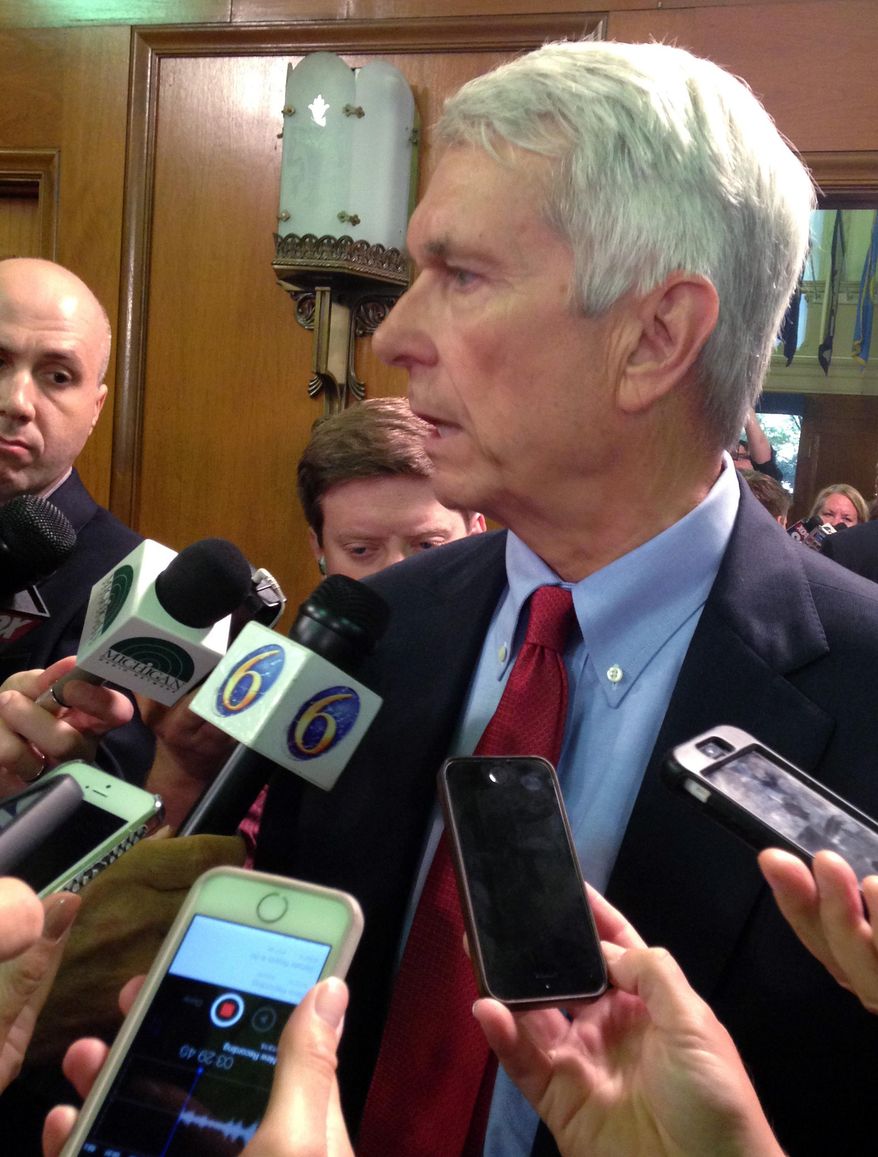 Michigan Public Service Commission member Norm Saari, former top aide to Republican House Speaker Kevin Cotter, answers reporters' questions after a Senate advice-and-consent hearing on Thursday, August 13, 2015 in Lansing, Mich. Democrats say Saari ignored whether Reps. Todd Courser of Lapeer and Cindy Gamrat of Plainwell misused public funds in an attempt to hide their relationship. Saari told reporters he did nothing wrong and Cotter acted appropriately. (AP Photo/David Eggert)