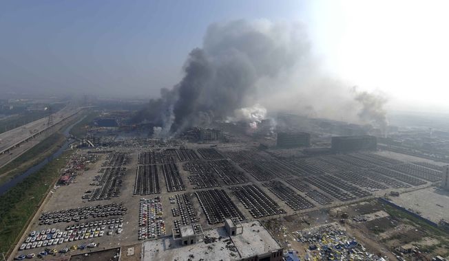 Huge explosions in the warehouse district of China&#x27;s Tianjin municipality sent up massive fireballs that turned the night sky into day, officials and witnesses said. (Xinhua via AP)