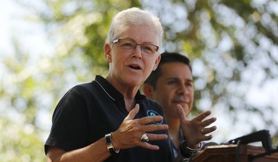Environmental Protection Agency Administrator Gina McCarthy speaks during a news conference with U.S. Rep. Ben Ray Lujan (right), on Aug. 13, 2015, along the Animas River Trail in Berg Park in Farmington, N.M. (Jon Austria/The Daily Times via Associated Press) ** FILE **
