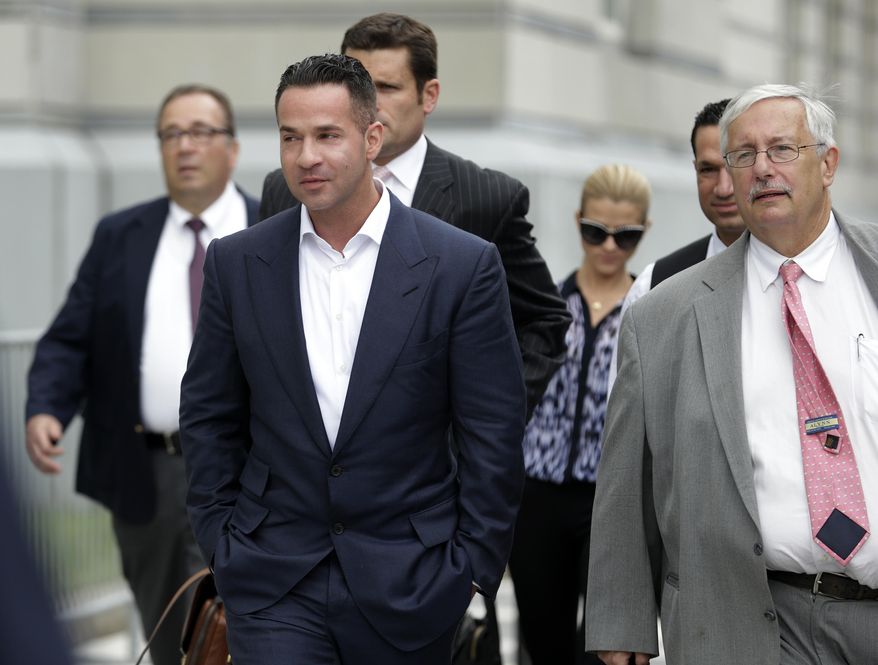 FILE - In this Wednesday, Sept. 24, 2014 file photo, TV personality Mike "The Situation" Sorrentino, left, walks with his lawyer, Richard Sapinski, right, while leaving the MLK Jr. Federal Courthouse in Newark, N.J., after a court appearance in Newark. On Friday, Aug. 14, 2015, a judge gave Sorrentino until mid-October to get a new attorney and declined his request for a court-appointed attorney, after Sapinski withdrew from the federal tax fraud case. (AP Photo/Julio Cortez)
