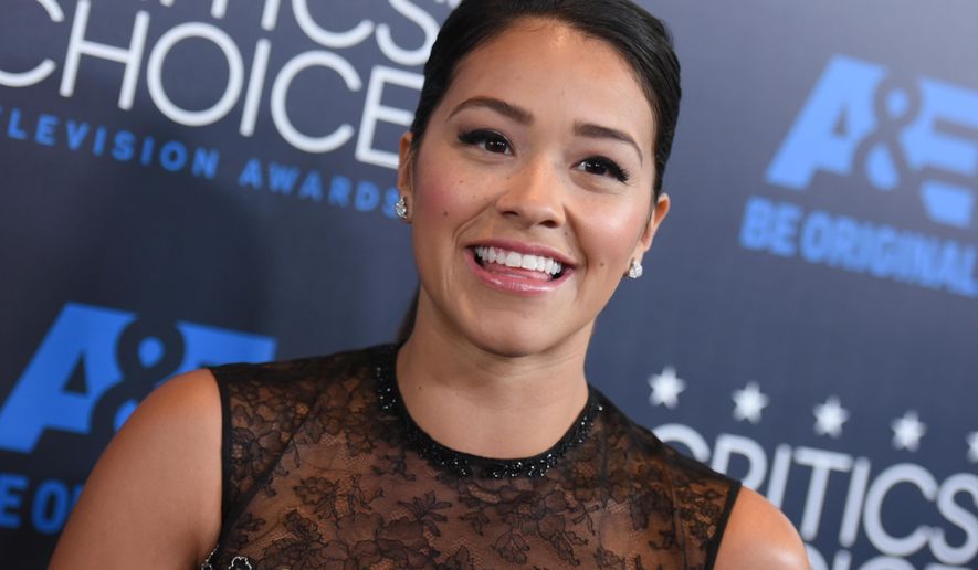 FILE - In this Sunday, May 31, 2015, file photo, Gina Rodriguez arrives at the Critics' Choice Television Awards at the Beverly Hilton hotel, in Beverly Hills, Calif. Rodriguez sees herself as uniquely positioned to serve as a role model, both for fellow Latinos and for young people everywhere. (Photo by Richard Shotwell/Invision/AP, File)