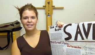 In this May 30, 2013, photo, Kayla Mueller is shown after speaking to a group in Prescott, Ariz. The parents of the late American hostage Kayla Mueller say they were told by American officials that their daughter was repeatedly forced to have sex with Abu Bakr Baghdadi, the leader of the Islamic State group. (AP Photo/The Daily Courier, Jo. L. Keener)