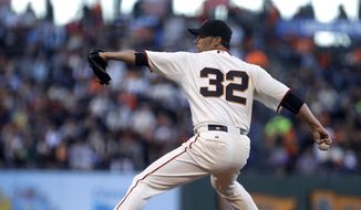San Francisco Giants pitcher Ryan Vogelsong works against the Washington Nationals in the first inning of a baseball game Thursday, Aug. 13, 2015, in San Francisco. (AP Photo/Ben Margot)