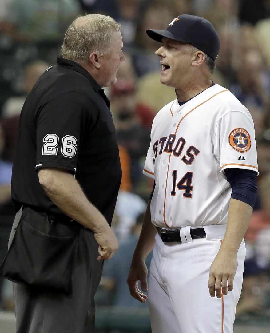 Houston Astros manager A.J. Hinch (14) argues with home plate umpire Bill Miller (26) about a call the fifth inning of a baseball game against the Detroit Tigers on Saturday, Aug. 15, 2015, in Houston. Hinch was ejected from the game. (AP Photo/Pat Sullivan)
