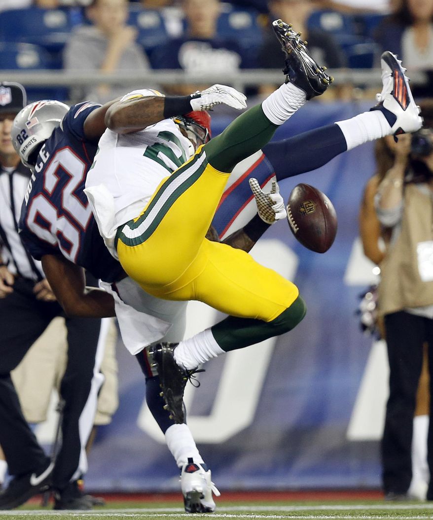 Green Bay Packers cornerback Quinten Rollins (24) breaks up a pass intended for New England Patriots wide receiver Josh Boyce (82) during the first half of an NFL preseason football game Thursday, Aug. 13, 2015, in Foxborough, Mass. (AP Photo/Michael Dwyer)
