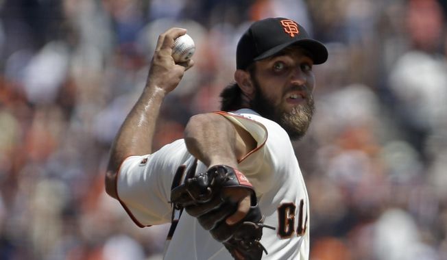 San Francisco Giants pitcher Madison Bumgarner works against the Washington Nationals in the first inning of a baseball game Sunday, Aug. 16, 2015, in San Francisco. (AP Photo/Ben Margot)
