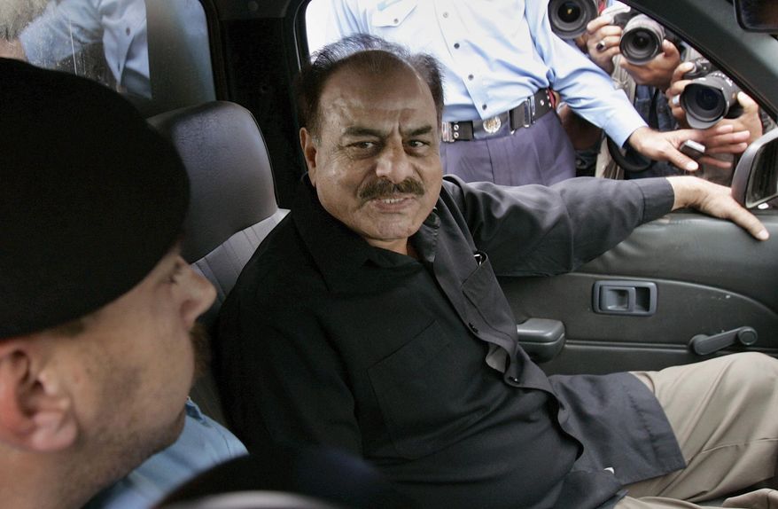 FILE - In this Nov. 4, 2007 file photo, former chief of Pakistan Inter Services Intelligence (ISI) Hameed Gul sits in a police vehicle in Islamabad, Pakistan. Family members say on Sunday, Aug. 16, 2015, Hameed Gul, the former head of Pakistan's Inter-Services Intelligence spy agency during the end of the Soviet occupation of Afghanistan and who supported Islamic militants, has died of a brain hemorrhage. He was 78. (AP Photo/B.K. Bangash, File)