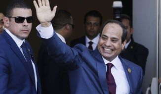 FILE - In this Aug. 6, 2015 file photo, Egyptian President Abdel-Fattah el-Sissi waves as he arrives to the opening ceremony of the new section of the Suez Canal in Ismailia, Egypt. A new 54-article anti-terrorism bill signed into law by el-Sissi was announced on Monday, Aug. 17, 2015, establishing stiffer prison sentences for offences deemed to be terrorism-related, heavy fines for journalists who publish “false news” and a special judicial circuit for terrorism-related cases. Egypt has not had a parliament for over two years, and legislative authority rests with el-Sissi. (AP Photo/Hassan Ammar, File)