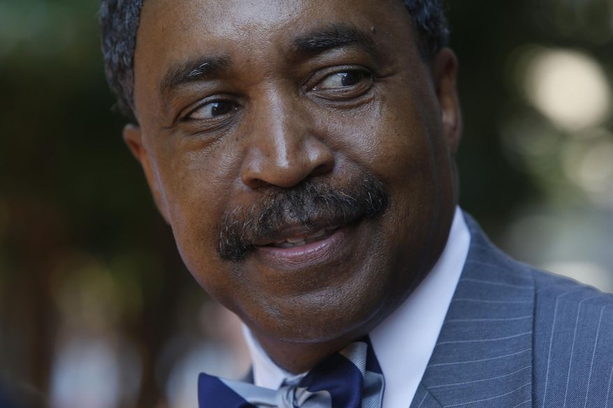 Judge Rossie D. Alston, from Manassas, Va, smiles as he leaves the General Assembly Building in Richmond, Va., Monday, Aug. 17, 2015, after appearing before the Joint Judicial Panel where he was interviewed for the Virginia Supreme Court. (Bob Brown/Richmond Times-Dispatch via AP) ** FILE **