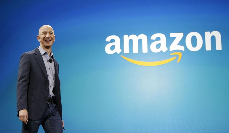 FILE - In this June 16, 2014, file photo, Amazon CEO Jeff Bezos walks onstage for the launch of the new Amazon Fire Phone, in Seattle. A New York Times article portrayed Amazon’s work culture as “bruising” and “Darwinian” in part because of the way it uses data to manage its staff. Amazon’s CEO said in a memo to staff on Monday, Aug. 17, 2015, that the article doesn’t accurately describe the company culture he knows. (AP Photo/Ted S. Warren, File)