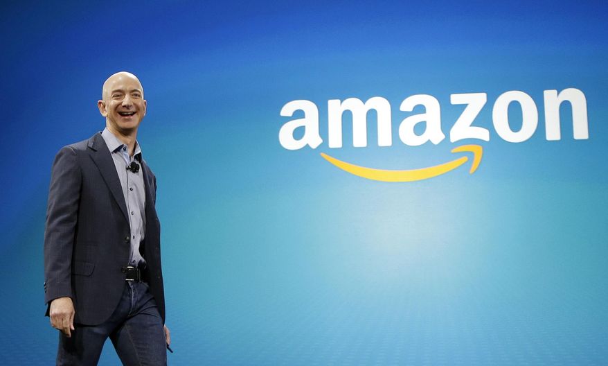 FILE - In this June 16, 2014, file photo, Amazon CEO Jeff Bezos walks onstage for the launch of the new Amazon Fire Phone, in Seattle. A New York Times article portrayed Amazon’s work culture as “bruising” and “Darwinian” in part because of the way it uses data to manage its staff. Amazon’s CEO said in a memo to staff on Monday, Aug. 17, 2015, that the article doesn’t accurately describe the company culture he knows. (AP Photo/Ted S. Warren, File)