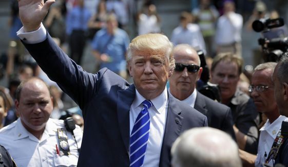 Donald Trump waves as he leaves for lunch after being summoned for jury duty in New York on Aug. 17, 2015. Trump was due to report for jury duty Monday in Manhattan. The front-runner said last week before a rally in New Hampshire that he would willingly take a break from the campaign trail to answer the summons. (Associated Press)