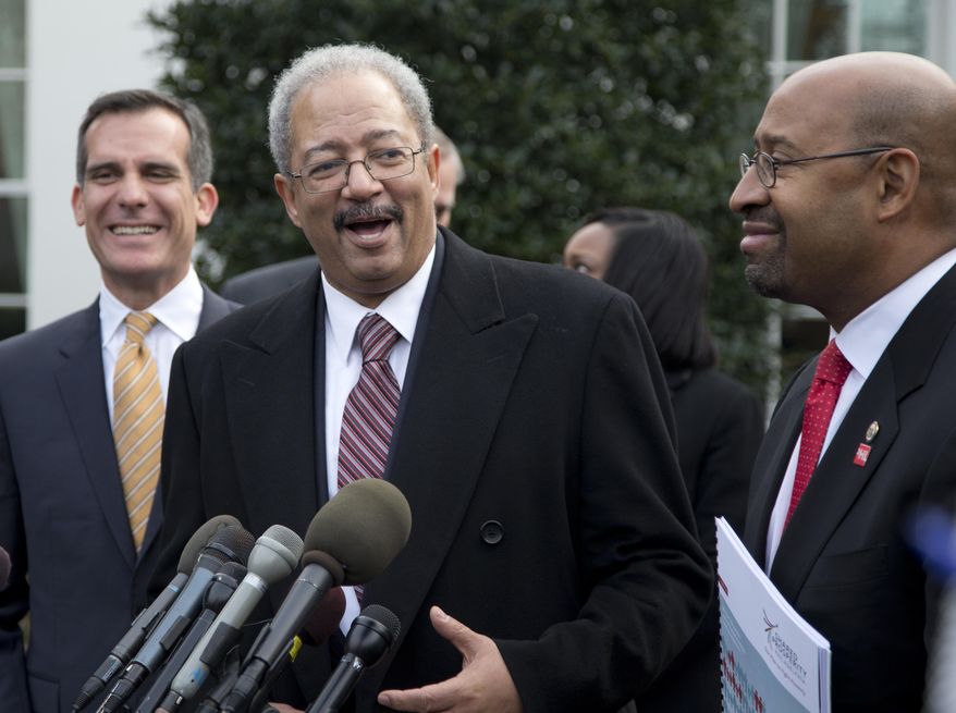 FILE - In this Jan. 9, 2014, file photo, Rep. Chaka Fattah, D-Pa., center, flanked by Los Angeles Mayor Eric Garcetti, left, and Philadelphia Mayor Michael Nutter, right, speaks outside the White House in Washington after an event hosted by President Barack Obama about the Promise Zones Initiative. Fattah is set Tuesday, Aug. 18, 2015, for his first court appearance in a federal racketeering case that centers on his alleged use of grants and charitable donations to repay a $1 million campaign loan. (AP Photo/Carolyn Kaster, File)