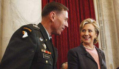 Then-Sen. Hillary Rodham Clinton, New York Democrat talks with Lt. Gen. David Petraeus on Capitol Hill on Jan. 23, 2007. (Associated Press)