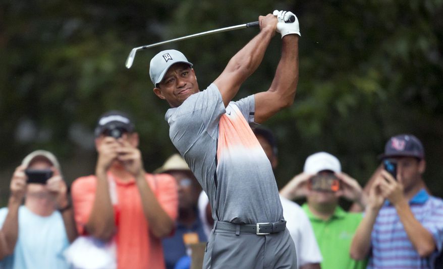 Tiger Woods tees off on the sixth hole during the pro-am at the Wyndham Championship golf tournament, Wednesday, Aug. 19, 2015, at Sedgefield Country Club in Greensboro, N.C. (AP Photo/Rob Brown)