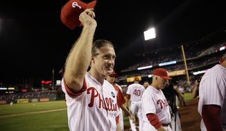 Chase Utley acknowledges cheers from the crowd as he walks off the field after the Phillies&#39; 7-4 win over the Toronto Blue Jays in Philadelphia. Utley was traded to the Los Angeles Dodgers on Wednesday night for two minor leaguers. (Associated Press)