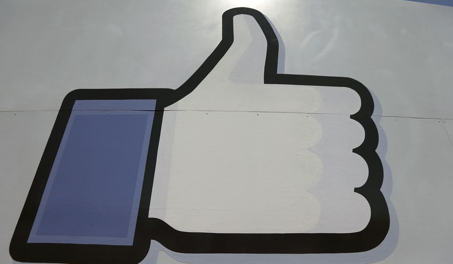 Facebook&#x27;s &quot;like&quot; symbol is posted at the entrance to the company&#x27;s campus in Menlo Park, California, in this June 11, 2014, photo. (AP Photo/Jeff Chiu) ** FILE **