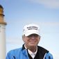FILE - In this Aug. 1, 2015, file photo, Republican presidential candidate Donald Trump poses for the media during the third day of the Women&#39;s British Open golf championship on Trump&#39;s Turnberry golf course in Turnberry, Scotland. Trump sells himself as a bold empire builder, the kind of risk taker who can force through big changes in Washington as president the country needs. Yet a review of the billionaire’s financial filings and recent deals suggests he’s no swashbuckler. Trump is reluctant to take on debt after it nearly ruined him in the 1990s, holds few stocks for someone of his wealth and has grown increasingly dependent on making money by lending out his name to others rather than developing real estate himself. (AP Photo/Scott Heppell, File)