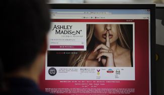 A June 10, 2015, file photo shows Ashley Madison&#39;s Korean website on a computer screen in Seoul, South Korea. (AP Photo/Lee Jin-man, File)
