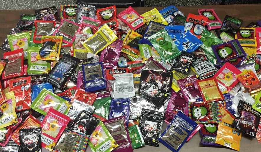 This file photo provided Friday, Aug. 7, 2015, by New York Police Department shows packets of synthetic marijuana seized after a search warrant was served at a newsstand in Brooklyn, N.Y. (AP Photo/New York Police Department) ** FILE **