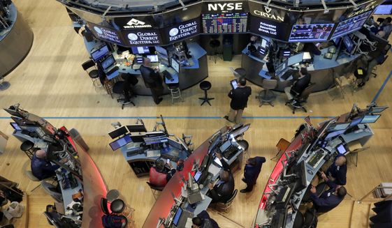 Traders work on the floor of the New York Stock Exchange, Friday, Aug. 21, 2015. U.S. stocks are sharply lower in midday trading on concerns about the Chinese economy. (AP Photo/Richard Drew)