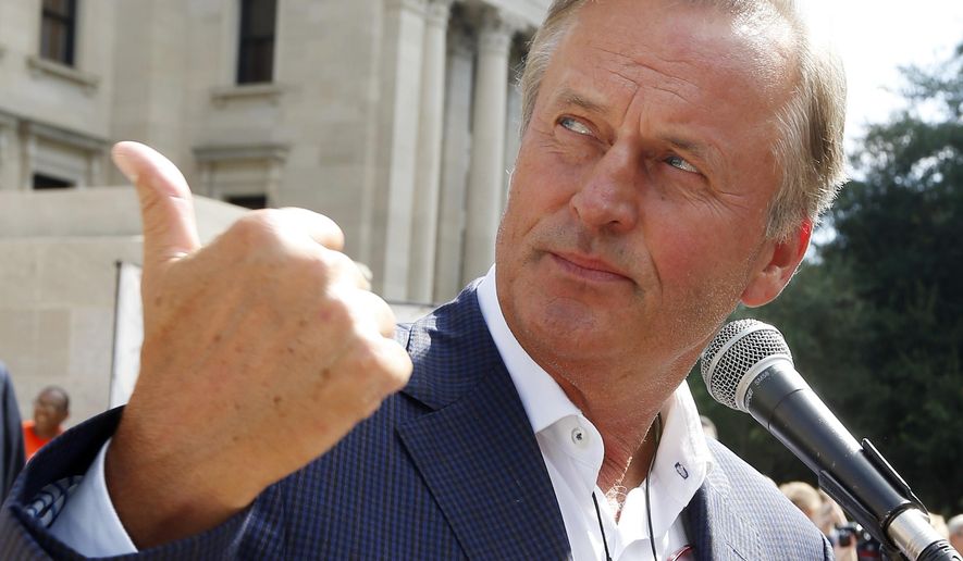 Best-selling author John Grisham serving as the master of ceremonies at the opening of the Mississippi Book Festival.. (AP Photo/Rogelio V. Solis)