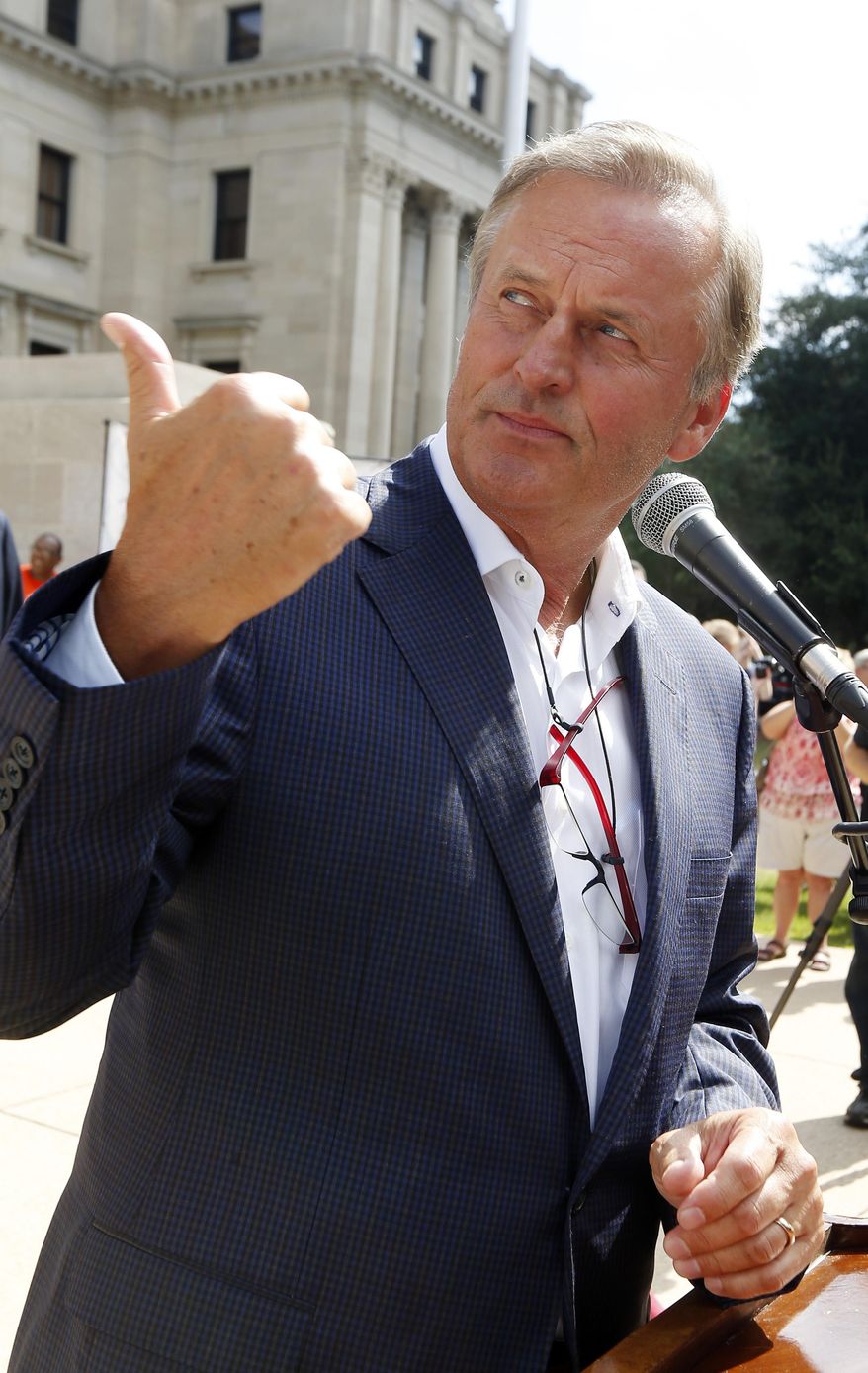 Best-selling author John Grisham serving as the master of ceremonies at the opening of the Mississippi Book Festival.. (AP Photo/Rogelio V. Solis)