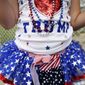 Laci Lamb, 6, of Lucedale, Miss., wears a beauty pageant dress her mother made for her before Republican presidential candidate and businessman Donald Trump speaks at a campaign pep rally, Friday, Aug. 21, 2015, in Mobile, Ala. (AP Photo/Brynn Anderson)