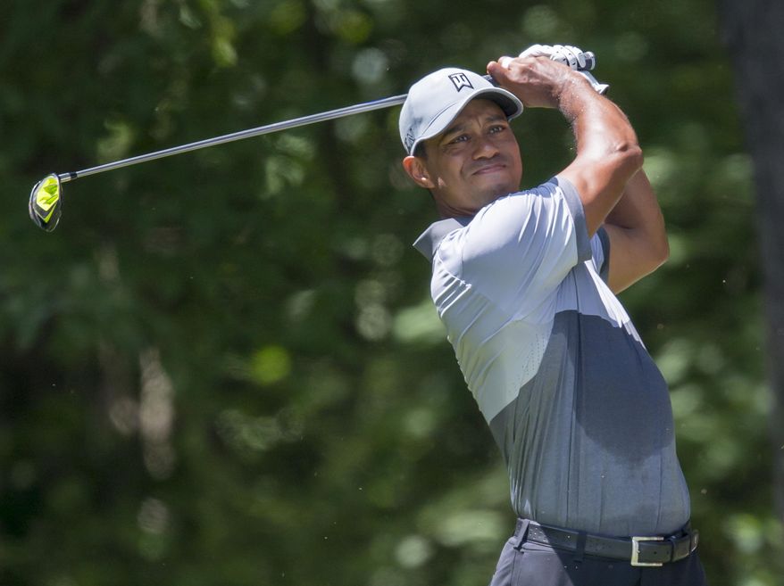 Tiger Woods tees off on the second hole during the third round of the Wyndham Championship golf tournament at Sedgefield Country Club in Greensboro, N.C., Saturday, Aug. 22, 2015. (AP Photo/Rob Brown)