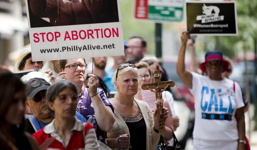 Pro-life activists demonstrate near a Planned Parenthood clinic in Philadelphia in this July 28, 2015, file photo. The protestors called for an end to government funding for the nonprofit reproductive services organization. (Associated Press)