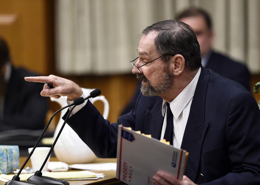 Frazier Glenn Miller Jr., a white supremacist charged with killing three people at two Jewish sites near Kansas City, argues with the prosecutor during the opening of his trial Monday, Aug. 24, 2015, in Olathe, Kan. The 74-year-old, who is representing himself in the capital murder trial, was halted so the judge could clarify what he was allowed to say. He later completed his abbreviated opening statement. (Shane Keyser/The Kansas City Star via AP, POOL)