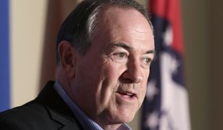 Republican presidential candidate Mike Huckabee speaks to the media in Little Rock, Ark., Monday, Aug. 24, 2015. The former Arkansas governor returned to his home state Monday night for a fundraiser and party to mark his 60th birthday. (AP Photo/Danny Johnston)