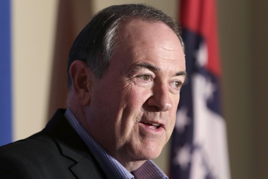 Republican presidential candidate Mike Huckabee speaks to the media in Little Rock, Ark., Monday, Aug. 24, 2015. The former Arkansas governor returned to his home state Monday night for a fundraiser and party to mark his 60th birthday. (AP Photo/Danny Johnston)