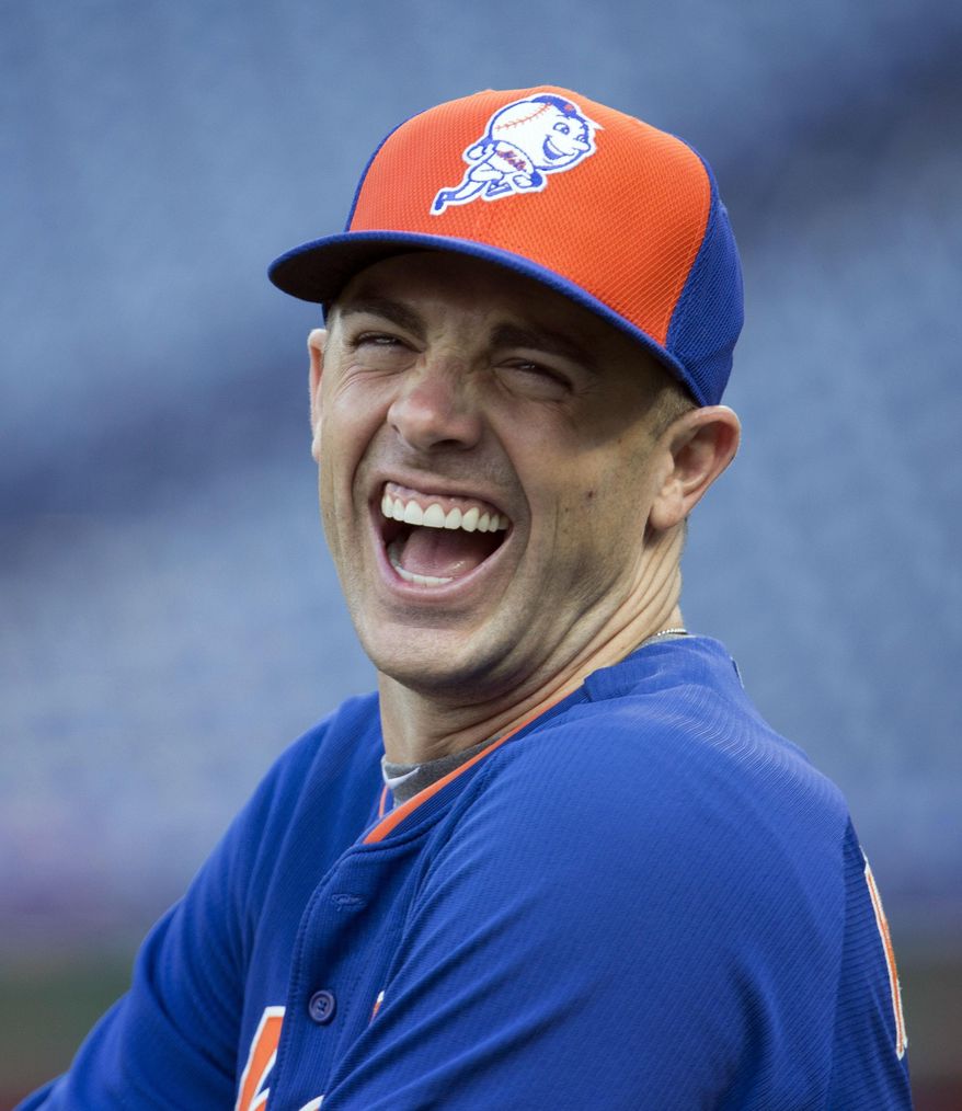 New York Mets third baseman David Wright laughs during warmups before the start of a baseball game with the Philadelphia Phillies, Monday, Aug. 24, 2015, in Philadelphia. (AP Photo/Laurence Kesterson)