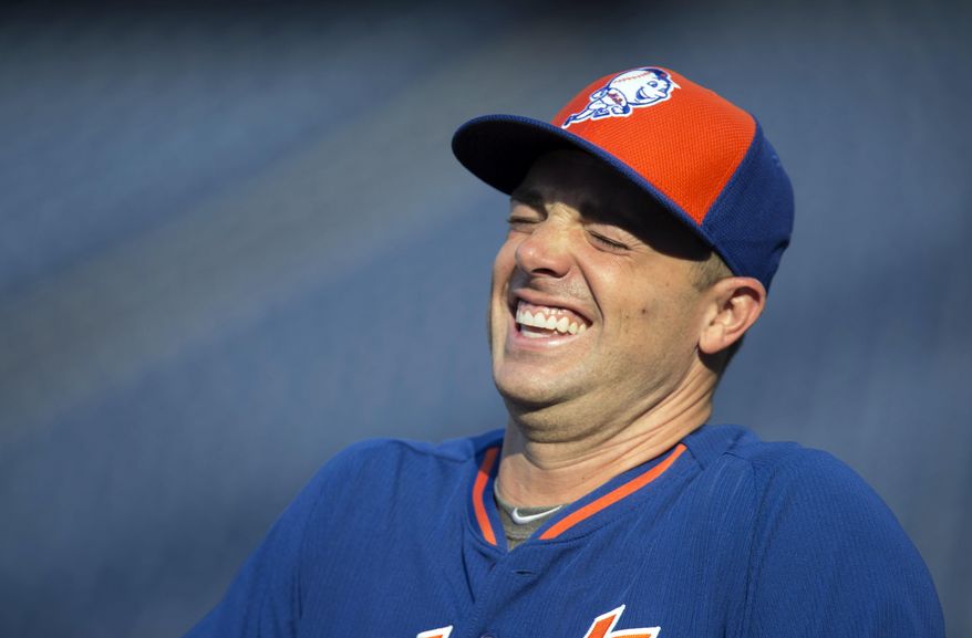 New York Mets third baseman David Wright laughs during warmups before the start of a baseball game with the Philadelphia Phillies, Monday, Aug. 24, 2015, in Philadelphia. (AP Photo/Laurence Kesterson)