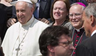 In this Wednesday, June 24, 2015 file photo, Philadelphia&#39;s Archbishop Charles Chaput, right, stands next to Pope Francis as they pose for a photo with a delegation from Philadelphia at the end of the pontiff&#39;s weekly general audience in St. Peter&#39;s Square at the Vatican. Pope Francis will be traveling to Philadelphia in September to attend the World Meeting of Families. Chaput, the meeting&#39;s host, is moving to limit lesbian, gay, bisexual and transgender Roman Catholics as they try to lobby for a broader role in the event. (AP Photo/Riccardo De Luca)