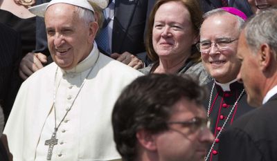 In this Wednesday, June 24, 2015 file photo, Philadelphia&#x27;s Archbishop Charles Chaput, right, stands next to Pope Francis as they pose for a photo with a delegation from Philadelphia at the end of the pontiff&#x27;s weekly general audience in St. Peter&#x27;s Square at the Vatican. Pope Francis will be traveling to Philadelphia in September to attend the World Meeting of Families. Chaput, the meeting&#x27;s host, is moving to limit lesbian, gay, bisexual and transgender Roman Catholics as they try to lobby for a broader role in the event. (AP Photo/Riccardo De Luca)