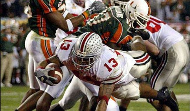 OHIO STATE 31, MIAMI 24. Maurice Clarett and the Ohio State Buckeyes stunned the Miami Hurricanes in a 2 OT thriller in the 2003 Fiesta Bowl, the BCS championship game. 
